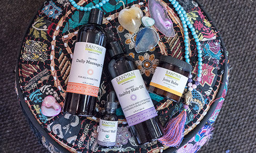 Yoga and meditation session in Las Vegas with a display of Ayurvedic products used for enhancing well-being and relaxation.