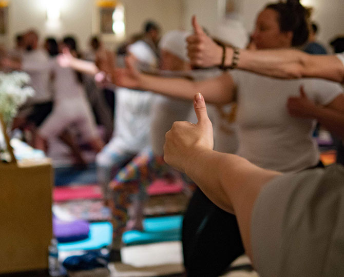 Group yoga and meditation session – A peaceful environment for collective healing and transformation.